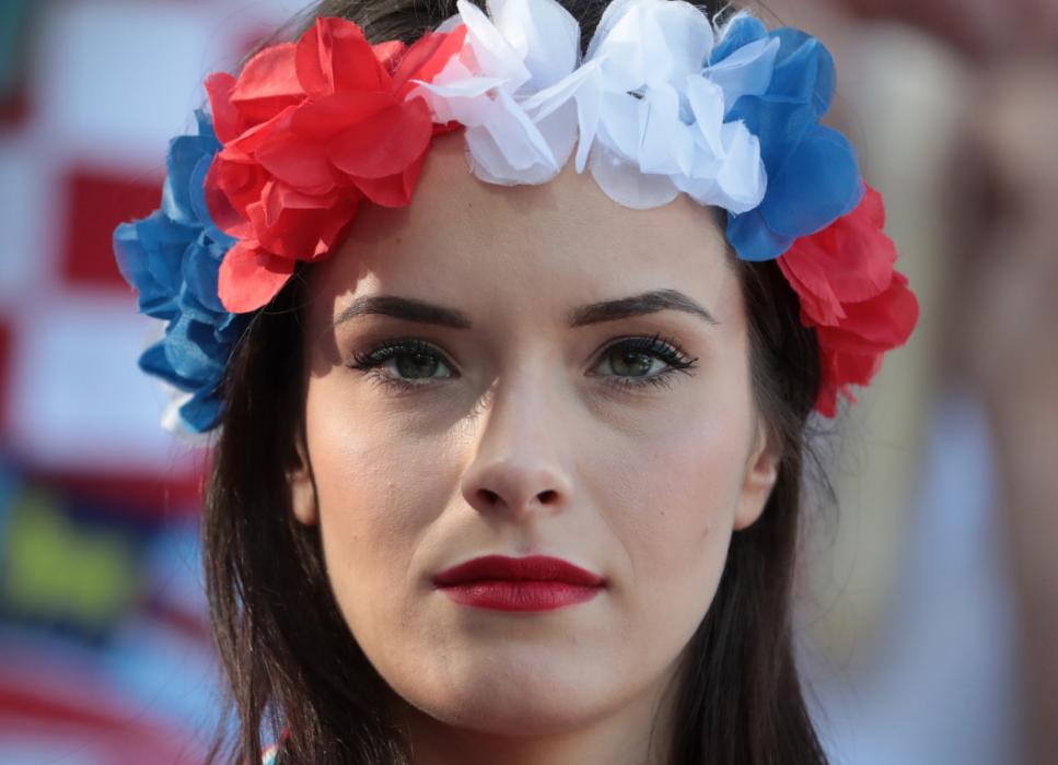 A Croatia supporter smiles before the round of sixteen football match Croatia against Portugal of the Euro 2016 football tournament, on June 25, 2016 at the Bollaert-Delelis stadium in Lens. / AFP PHOTO / KENZO TRIBOUILLARD