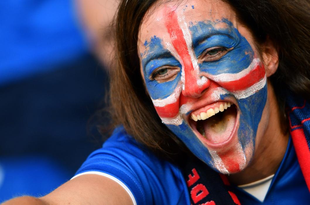 An Iceland supporter cheers prior to the Euro 2016 round of 16 football match between England and Iceland at the Allianz Riviera stadium in Nice on June 27, 2016. / AFP PHOTO / BERTRAND LANGLOIS