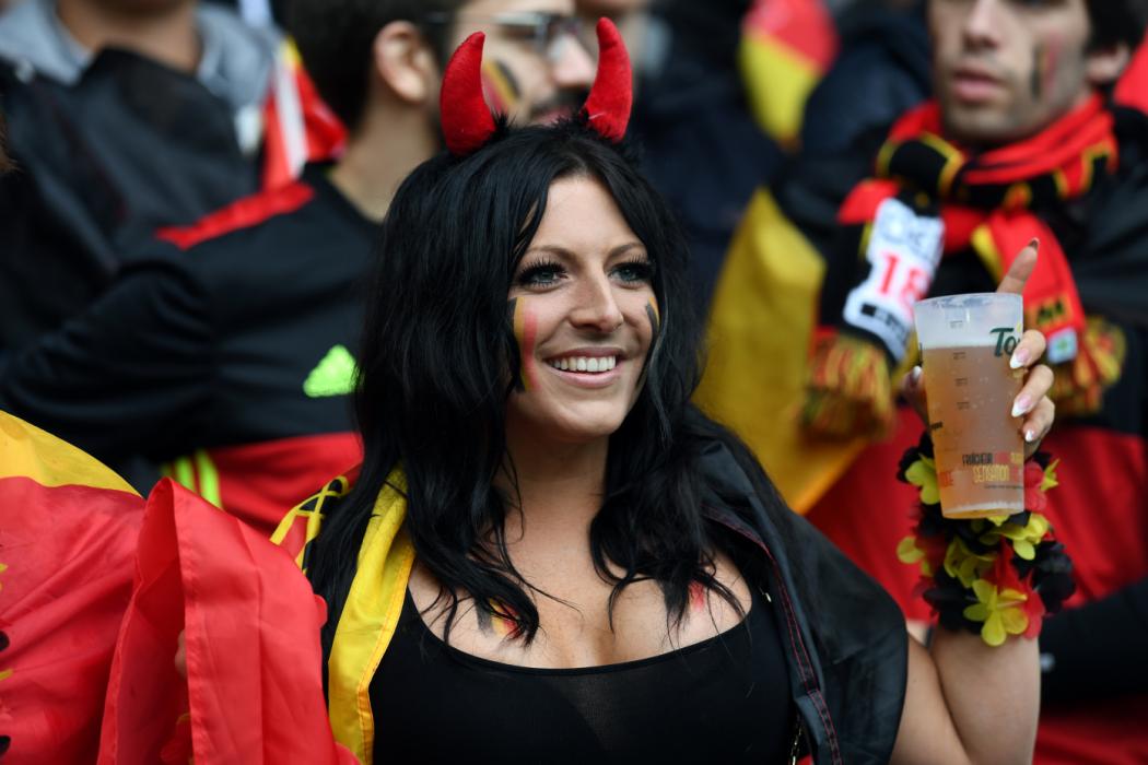 A Belgium supporter poses ahead the Euro 2016 quarter-final football match between Wales and Belgium at the Pierre-Mauroy stadium in Villeneuve-d'Ascq near Lille, on July 1, 2016. / AFP PHOTO / PAUL ELLIS