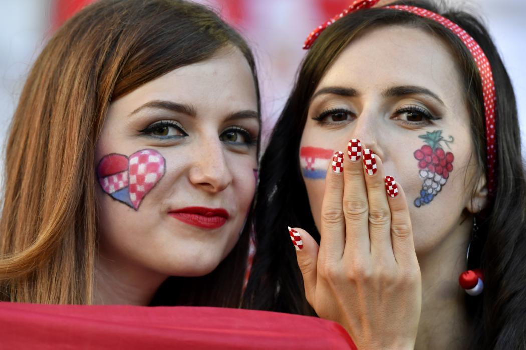 Croatia supporters pose for a picture during the Euro 2016 group D football match between Croatia and Spain at at the Matmut Atlantique stadium in Bordeaux on June 21, 2016. / AFP PHOTO / Georges GOBET
