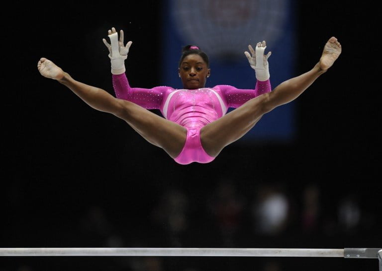 US gymnast Simone Biles performs on the uneven bars during the women's